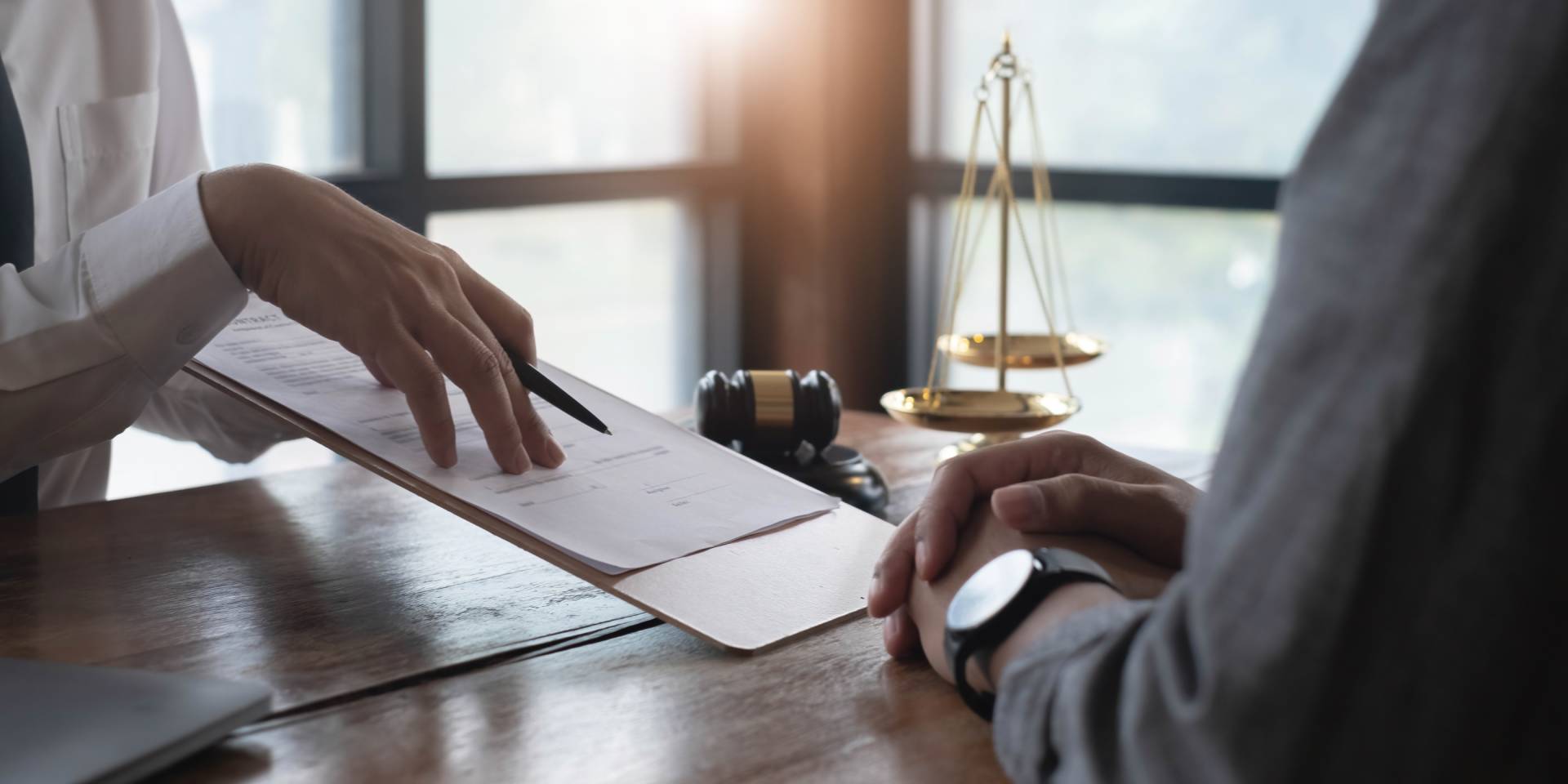 Judge with clipboard showing client paperwork